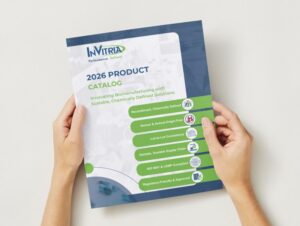 Hands holding the InVitria 2026 product catalog featuring recombinant, animal-origin-free proteins for biomanufacturing.